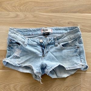 Light denim distressed short shorts; Size 0